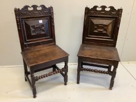 A pair of late 17th century oak wood seat chairs with moulded panelled backs, width 51cm, depth