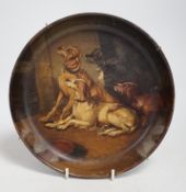 A late 19th century painted papier mache dish, Ready for the Sport, decorated with seated