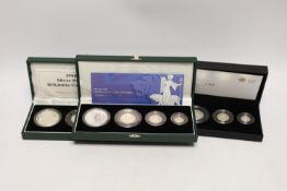 Three Royal Mint UK QEII four-coin silver proof Britannia collection sets for 1998, 2001 and 2008, 3