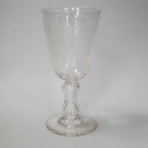 A lead crystal commemorative Gretna Green goblet, with fine engraving of a blacksmith and couple