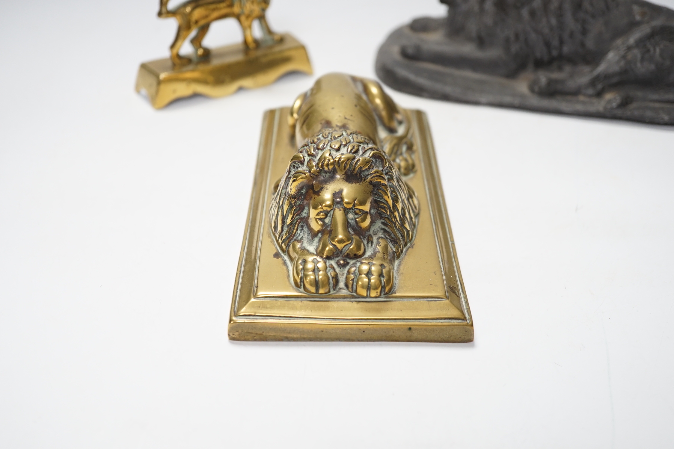 A 19th century brass recumbent lion, a similar cast iron lion and a smaller lion, largest 22cm wide - Image 3 of 5