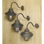 A trio of brass porch lanterns, 38cm high