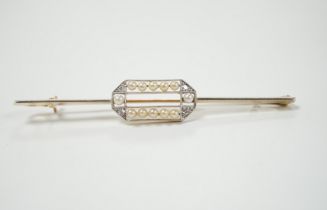 A Belle Epoque 15ct, diamond and seed pearl set bar brooch, 63mm, gross weight 3.9 grams.