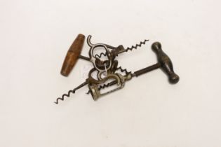 Five assorted vintage corkscrews including a folding example