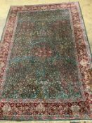 An Isphahan green ground rug, 232 x 152cm