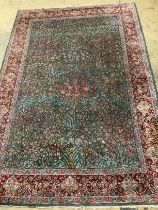 An Isphahan green ground rug, 232 x 152cm