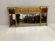 A Regency triple plate gilt-framed overmantel mirror with painted panels, width 150cm, height 74cm