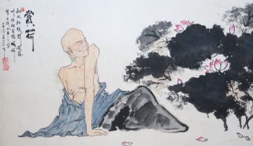 A large Chinese watercolour of a seated figure beside lotus flowers, 66 x 110cm