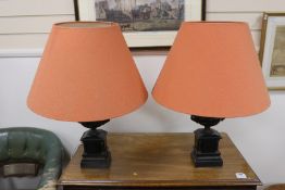 A pair of bronze and polished slate urns, converted to desk lamps (likely ex clock garniture),