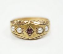 A late Victorian 15ct gold, ruby and split pearl set half hoop ring, size M, gross weight 2.7