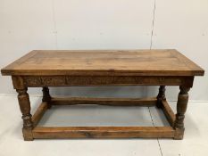A 17th century style rectangular oak refectory dining table, incorporates old timber, width 168cm,