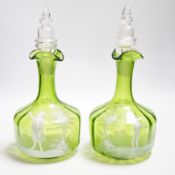 A pair of Mary Gregory glass decanters and stoppers, 26cm