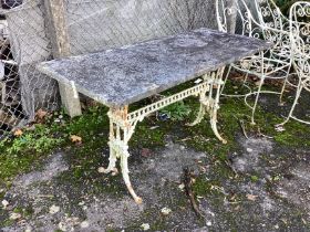 A Victorian cast iron table garden table with weathered marble top, width 139cm, height 71cm