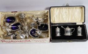 A George V silver nine piece condiment set, by Harrod's Ltd, Birmingham, 1933, a cased three piece