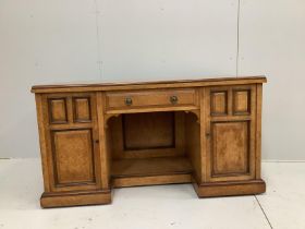 A late Victorian bird's eye maple kneehole desk by Moore and Hunton, London, width 140cm, depth