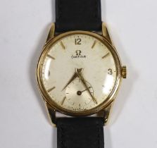 A gentleman's 9ct gold Omega manual wind wrist watch, with case back inscription, on associated