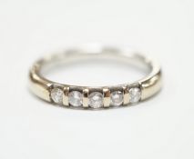 A modern 18ct white gold and five stone diamond set half hoop ring, size J, gross weight 3.6 grams.