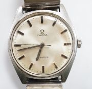 A gentleman's 1970's stainless steel Omega manual wind wrist watch, with baton numerals, cased