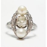 A white metal single stone diamond and two stone cultured pearl set oval ring, with diamond chip set