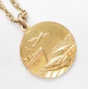 A 1970's 9ct gold St. Christopher's pendant, 27mm, on a 9ct chain, 65cm, 22.6 grams.