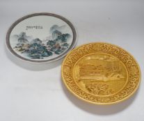 Two Chinese plates, resin and porcelain, largest 26cm diameter