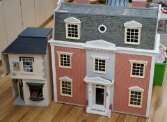 A modern Georgian style dolls house, with two front opening doors, containing six rooms with