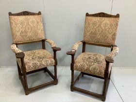 A pair of oak elbow chairs, width 64cm, depth 60cm, height 114cm