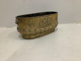 A 19th century oval Dutch embossed brass log bin, length 62cm, width 34cm, height 27cm