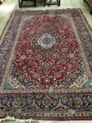 A North West Persian red ground carpet, 300 x 200cm