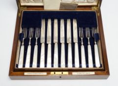 A cased set of twelve pairs of George V mother of pearl handled silver dessert eaters,