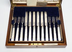 A cased set of twelve pairs of George V mother of pearl handled silver dessert eaters,