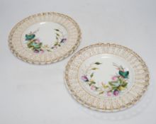 * * A set of nine French porcelain dessert dishes, painted with roses, and a larger, matching cake