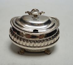 * * A George III demi fluted silver lidded mustard pot, London 1811 by Alexander Hewat?, length 9cm.