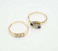 An 18ct gold and three stone diamond ring, size M and an 18ct, sapphire and diamond set three