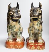 A pair of Chinese Macau porcelain lion dogs, 43cm