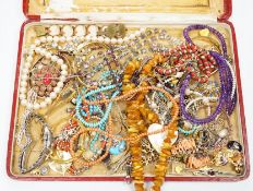 Assorted costume jewellery including amber necklace, coral necklace, cameo shell bracelet etc.