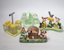 A group of vintage cruet and condiment sets, mostly china, in the form of animals, women in Welsh