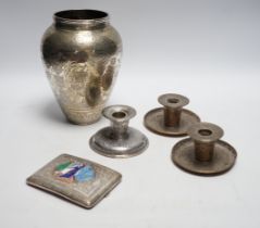 Three Persian white metal dwarf candlesticks including a pair, base 88mm, a similar white metal