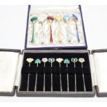 A cased set of six Danish gilt sterling and polychrome enamelled coffee spoons and a cased set of