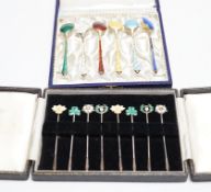 A cased set of six Danish gilt sterling and polychrome enamelled coffee spoons and a cased set of