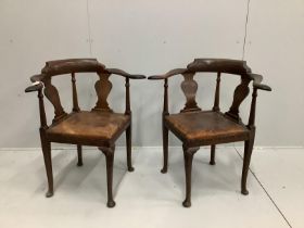 A pair of George II style mahogany corner elbow chairs, width 73cm, depth 60cm, height 80cm