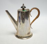 * * A George VI silver hot water pot, with rattan handle, Walker & Hall, Sheffield, 1937, height