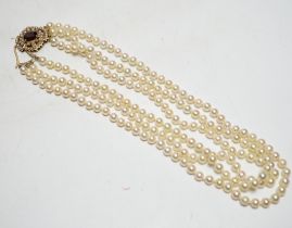 A 1960's triple strand cultured pearl necklace, by Cropp & Farr, with 9ct gold, garnet and seed
