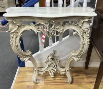 A Victorian carved wood and composition marble top serpentine console table, width 88cm, depth 45cm,
