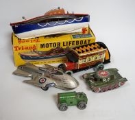A collection of tinplate toys including cars, a fire engine, a Firebird jet plane, a Tri-ang