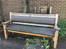An upholstered pitch pine bench, width 197cm, depth 53cm, height 102cm
