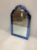 An Art Deco style wall mirror with blue glass border, width 51cm, height 81cm