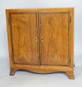 * * A George III style rosewood and tulipwood banded miniature two door chest, fitted with four