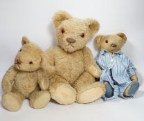 Two Invicta bears, 30cm and 45cm, some wear, and a Merrythought bear, dressed in vintage dressing