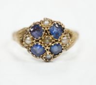 A Victorian 12ct gold sapphire and seed pearl cluster set ring, size M, gross weight 1.6 grams.